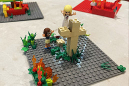 Group of people building Lego