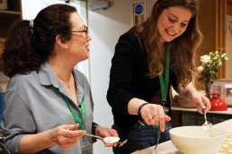 Two women serve in kitchen at St Mark's Harrogate